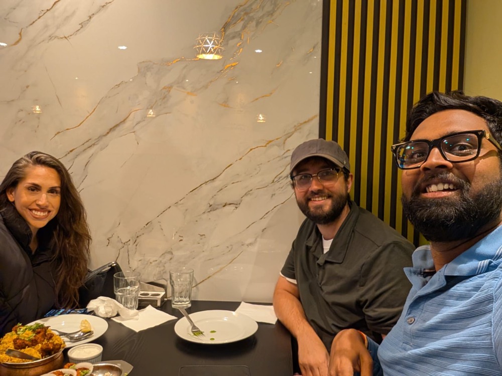 Raj and the Visma Promotions team sharing a meal together — a reflection of our family culture